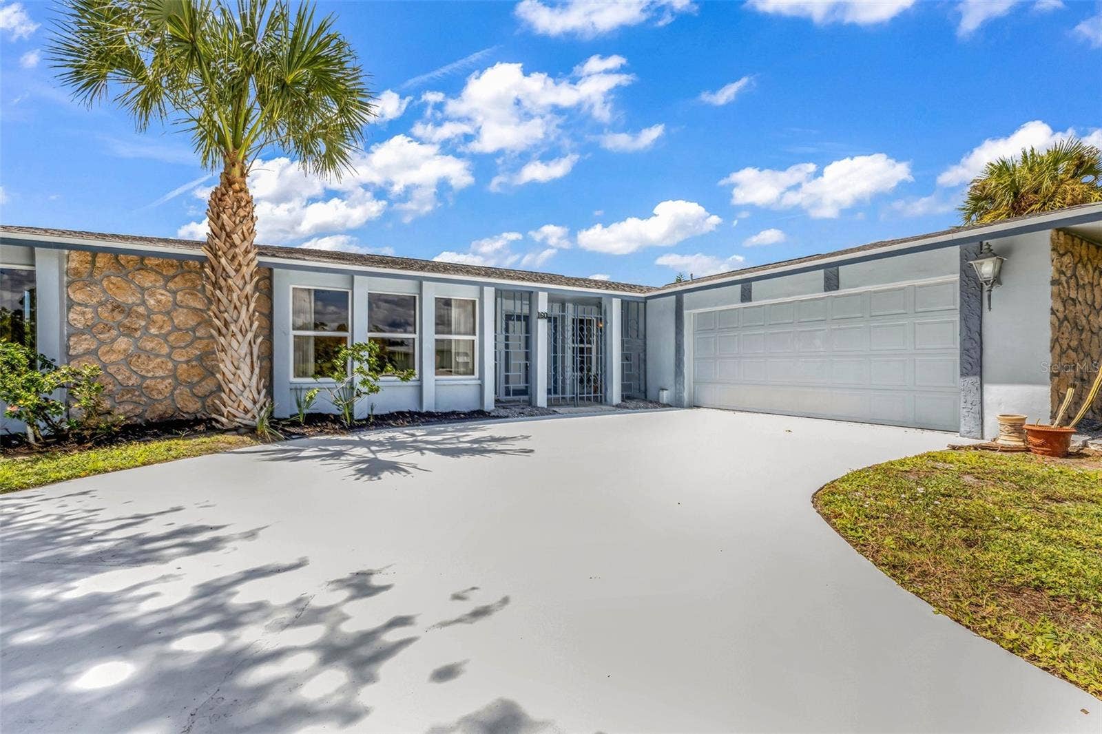 160 ANNAPOLIS LANE, Rotonda West, FL 33947 Expansive curved driveway. Pull up, park, and enter through the unique gated entrance to your private courtyard and double door entry.