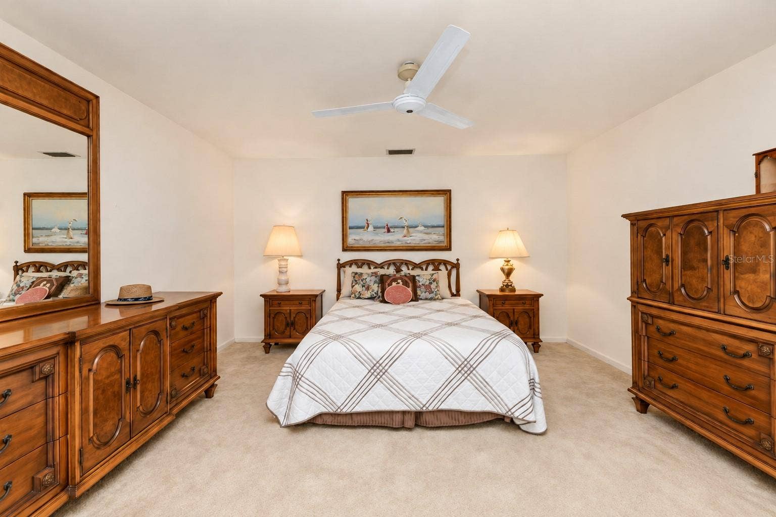 160 ANNAPOLIS LANE, Rotonda West, FL 33947 Primary bedroom (bed room 1) with double closets, ceiling fan, ensuite bathroom (shower only), and sliders to waterfront backyard.