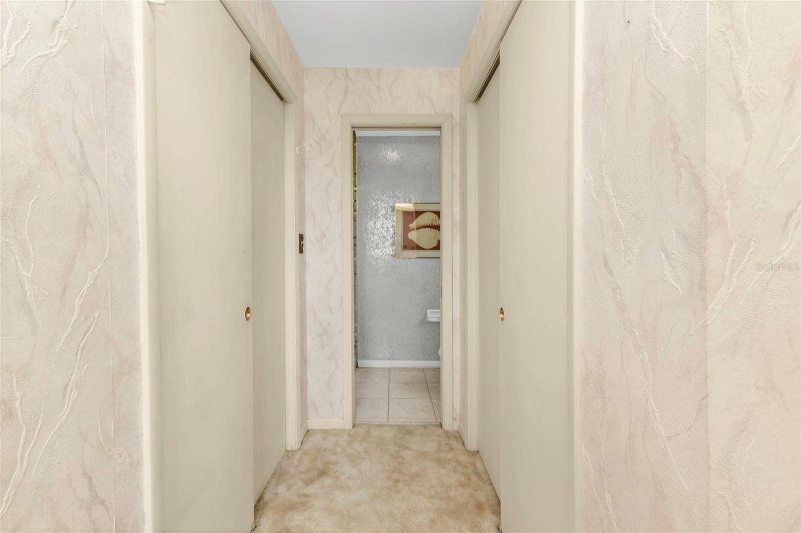 160 ANNAPOLIS LANE, Rotonda West, FL 33947 Closet on either side of private hallway located in primary bedroom