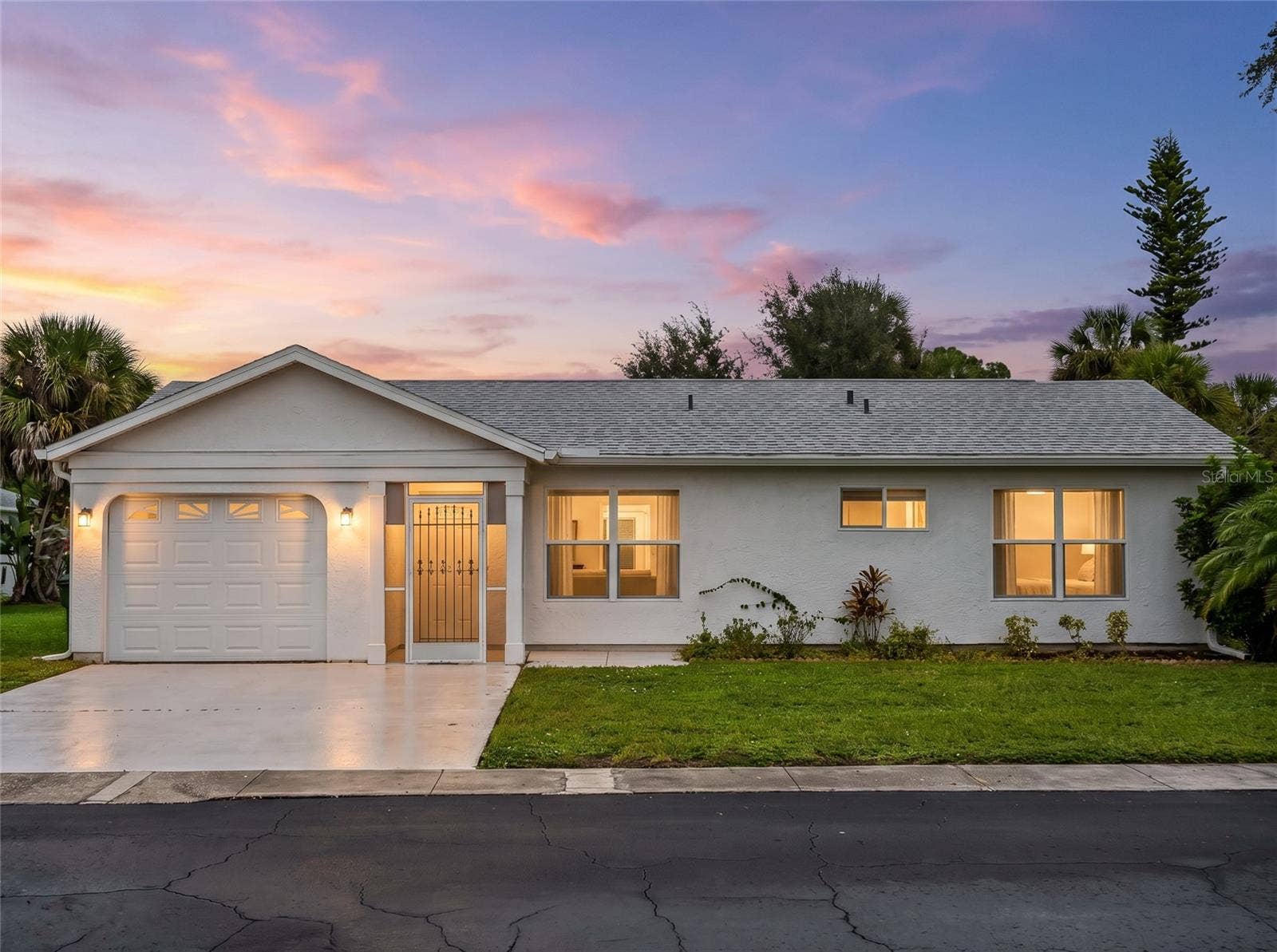 8130 PICKWICK ROAD, North Port, FL 34287 FrontExterior_8130PickwickRd_NorthPort_CurbAppeal_Twilight.jpg