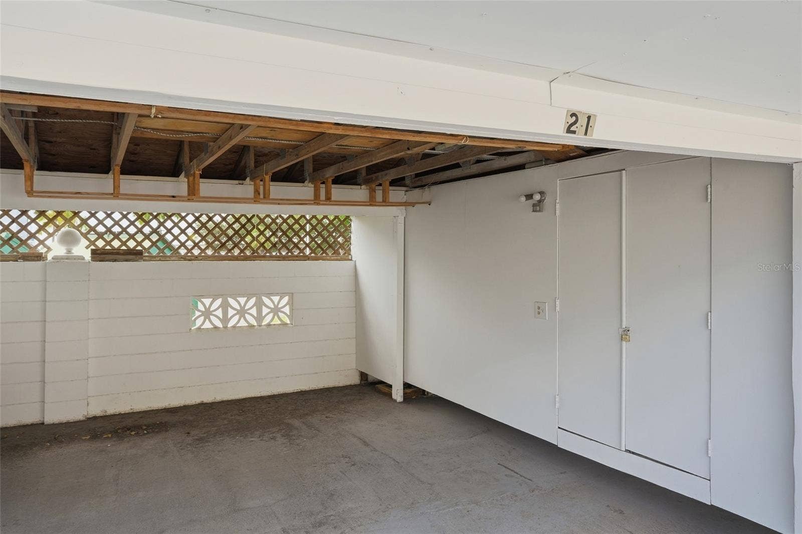 4158 TAMIAMI TRAIL, #P4, Port Charlotte, FL 33952 Garage with closet and overhead storage