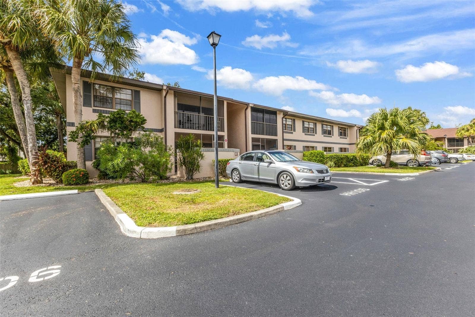 19505 QUESADA AVENUE, #H208, Port Charlotte, FL 33948 Front exterior and parking