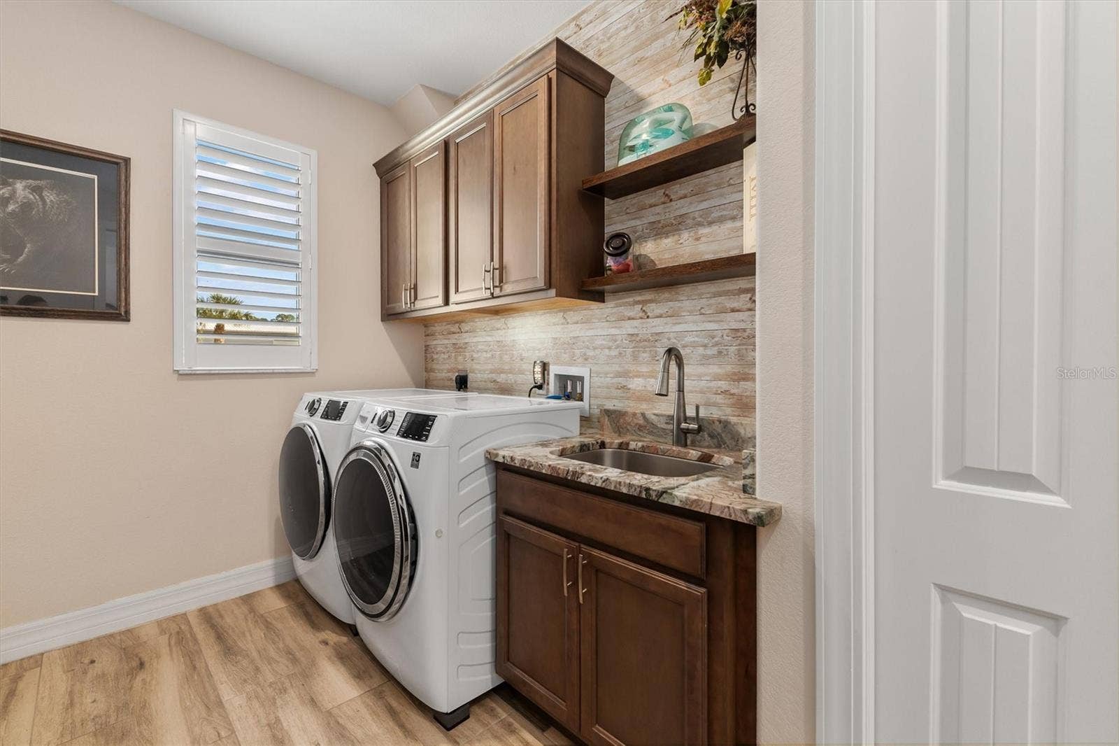 Laundry Room With Sink and Closet