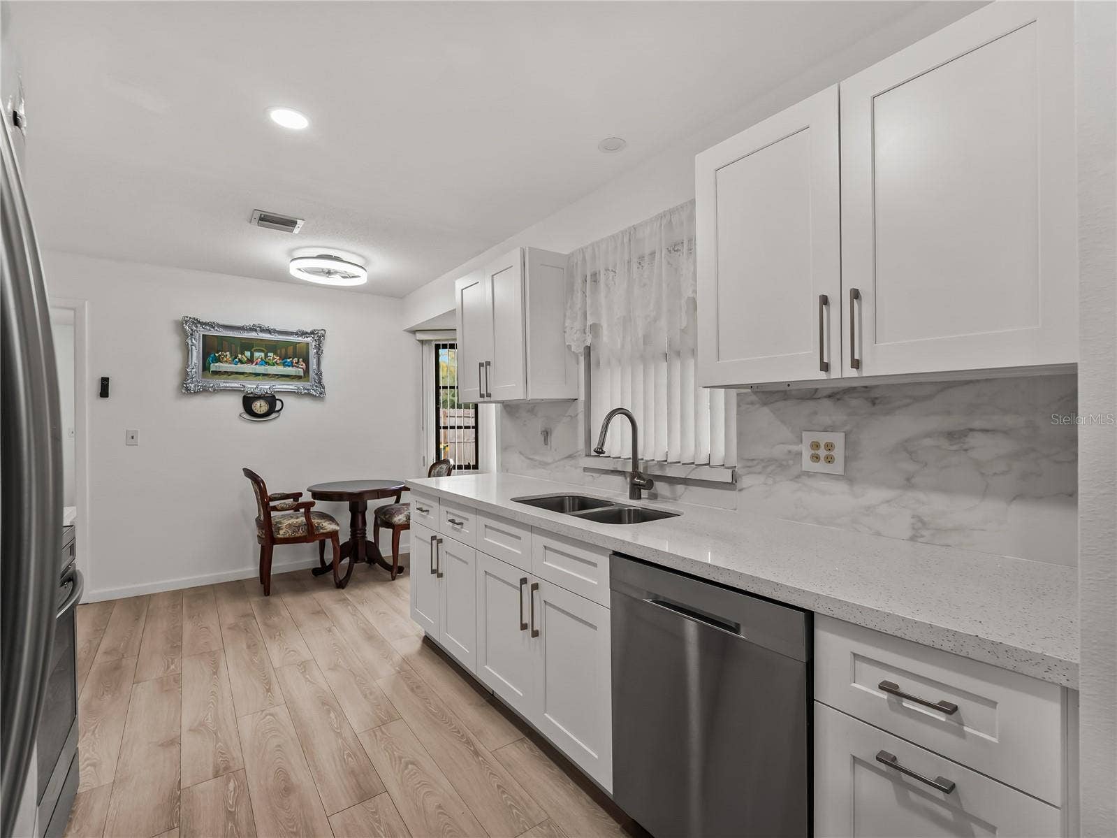 Kitchen_20307SilentAve_PortCharlotte_WhiteCabinetry_Wide.jpg
