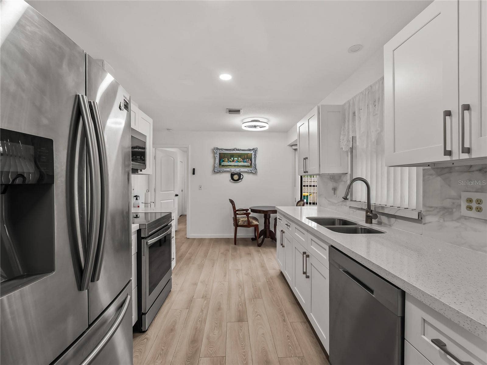Kitchen_20307SilentAve_PortCharlotte_StainlessAppliances_Wide.jpg