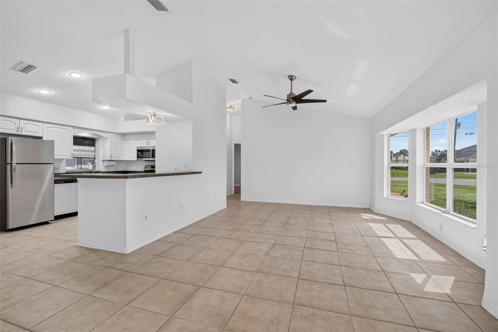 2184 ONONDAGA LANE, Punta Gorda, FL 33983 Living Room and Breakfast Bar- Another View (Tinted Windows)