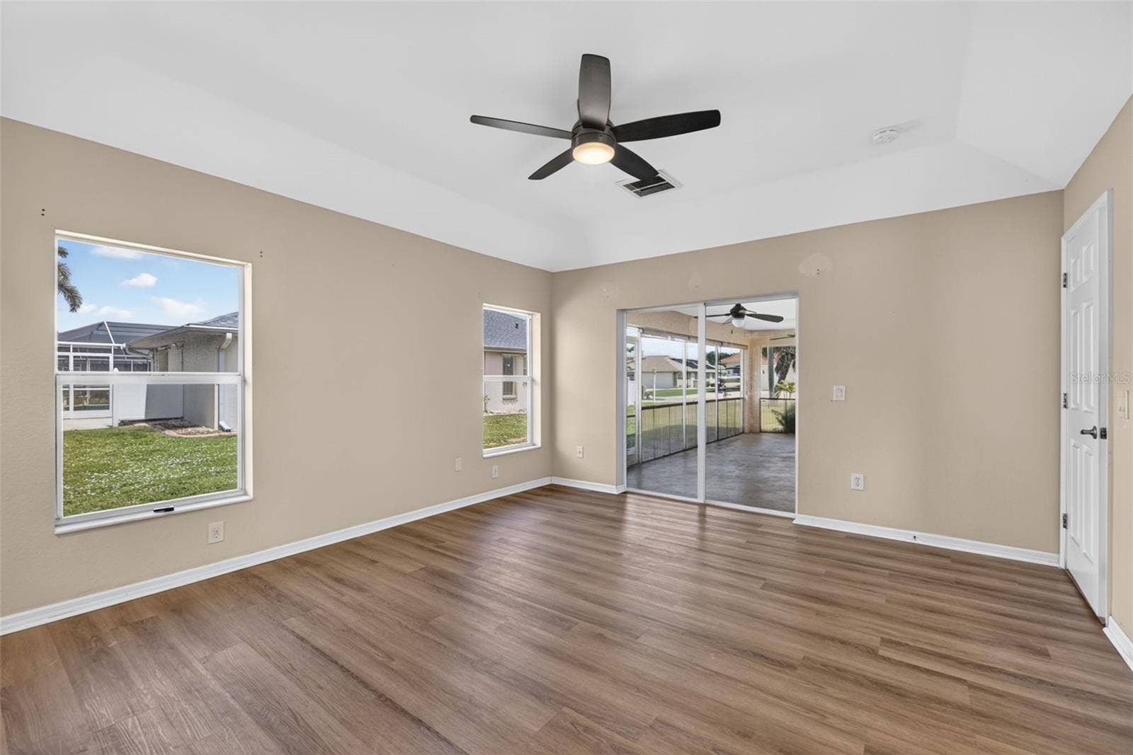 2184 ONONDAGA LANE, Punta Gorda, FL 33983 Primary Bedroom - Another View (Hide-a-way Sliders onto Lanai)