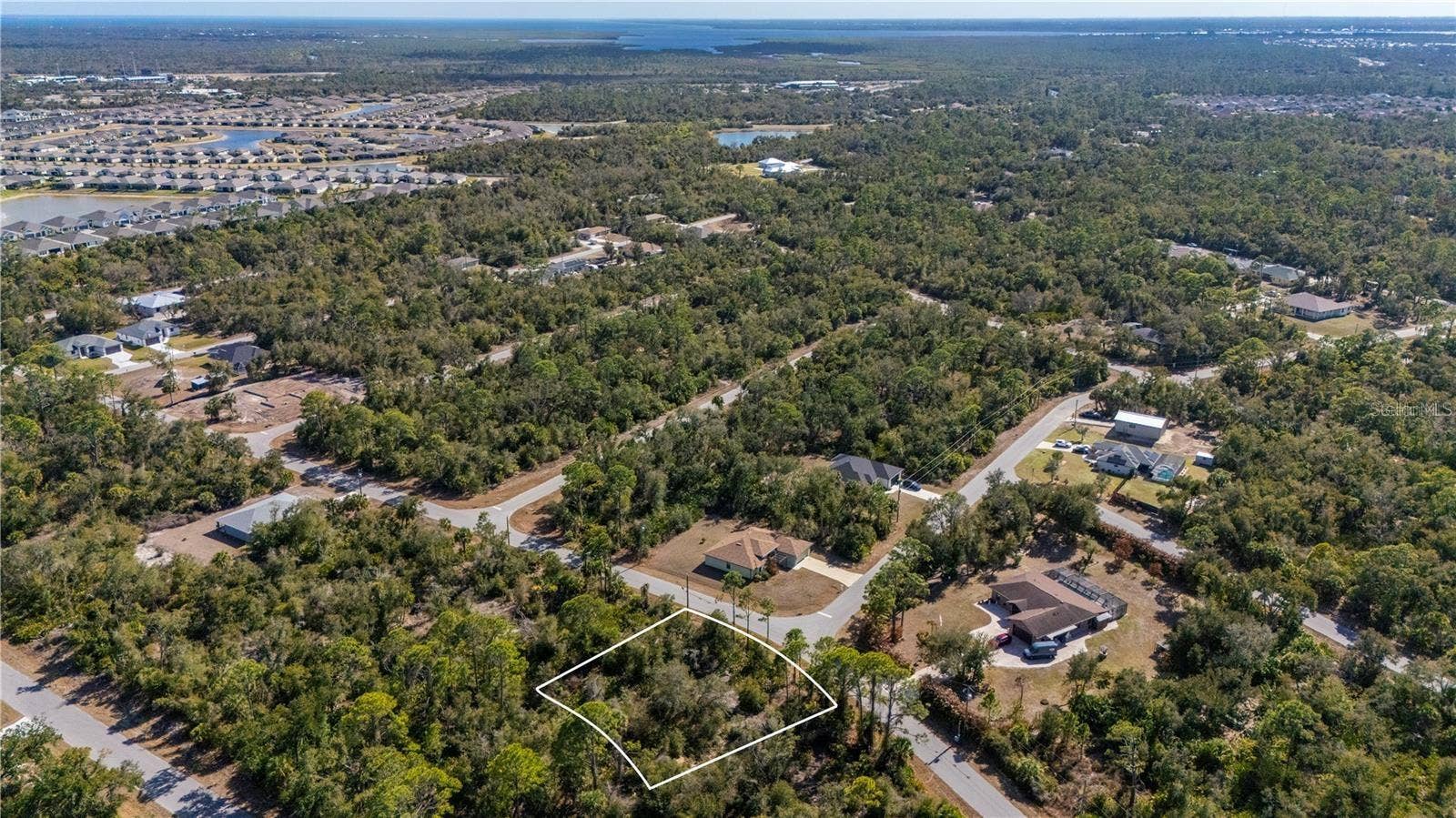 1216 SHERWIN STREET, Port Charlotte, FL 33953 View of the oversized lot and to the Southeast is the new communities of West Port.
