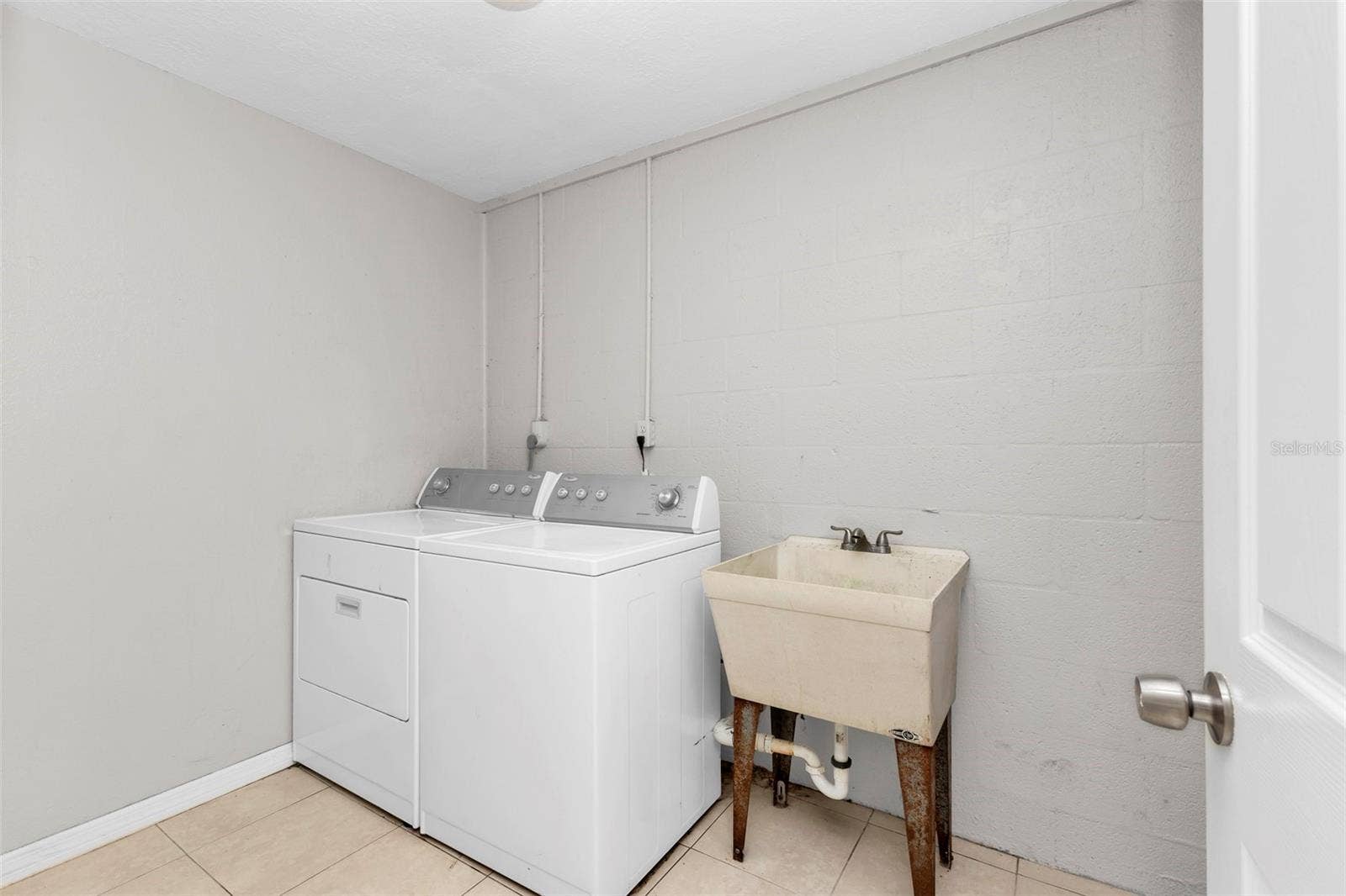 424 VANNELL STREET, Port Charlotte, FL 33954 Inside laundry room off of 3rd bedroom.