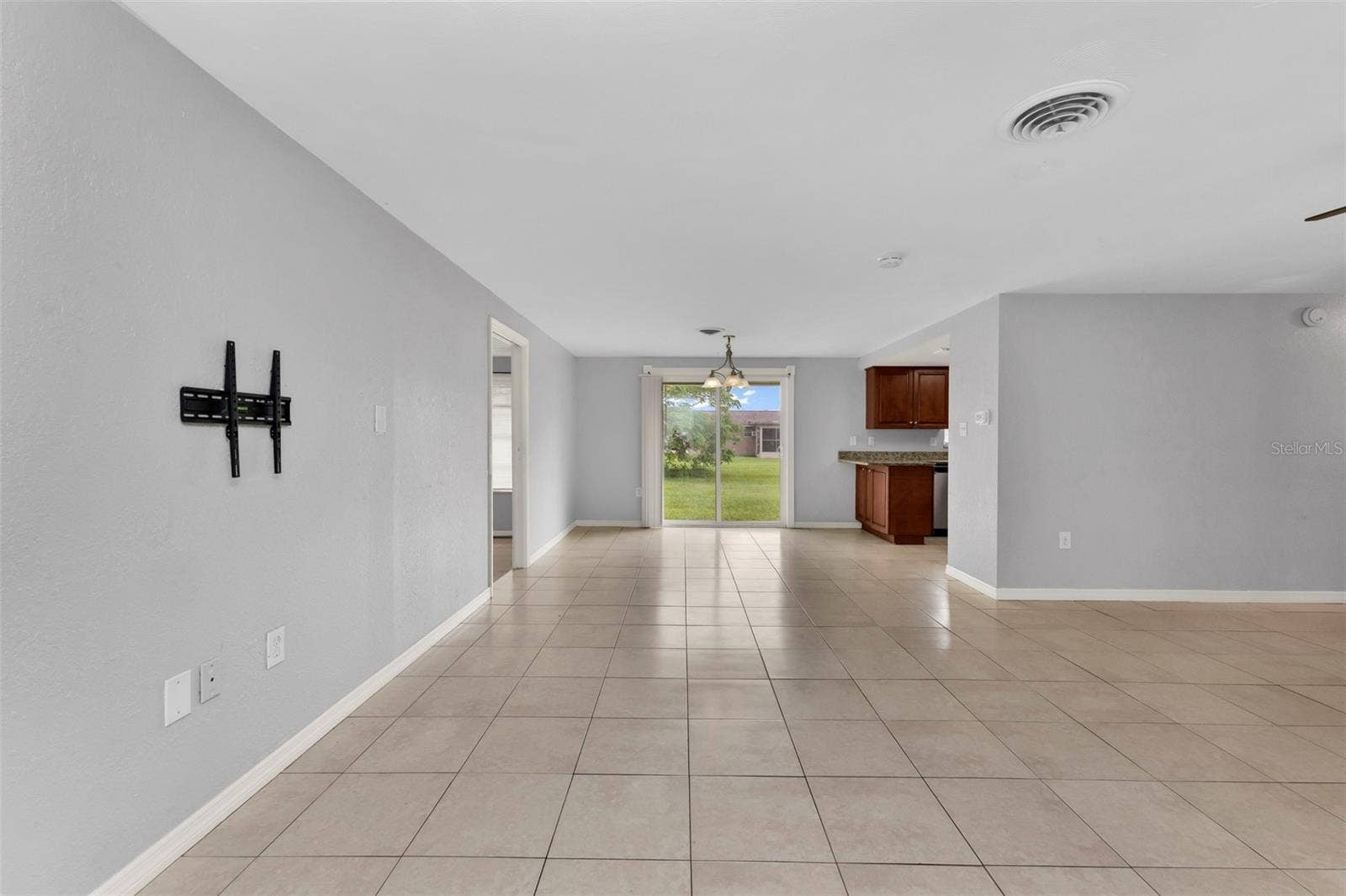 424 VANNELL STREET, Port Charlotte, FL 33954 Open floor plan from living room to dining area.