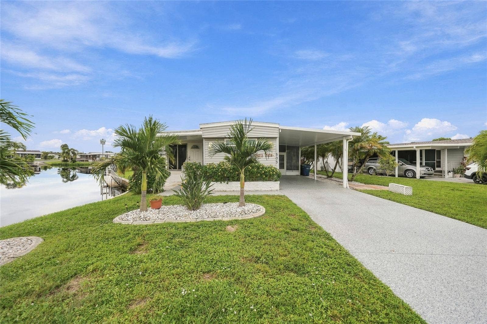 503 ALJO PLACE, North Port, FL 34287 Front of Home with Long Driveway
