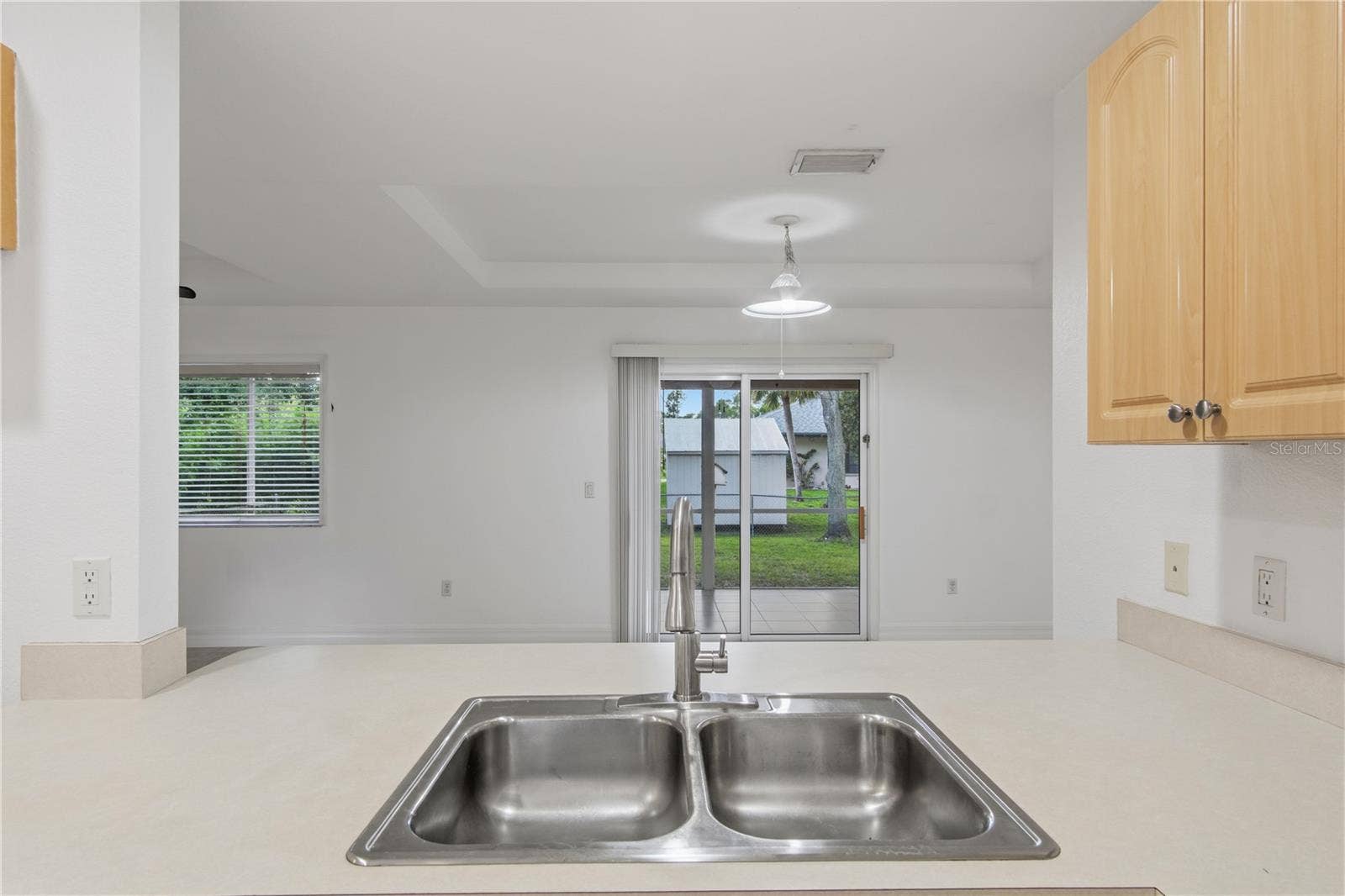 17433 HARRIS AVENUE, Port Charlotte, FL 33948 Kitchen overlooking living room