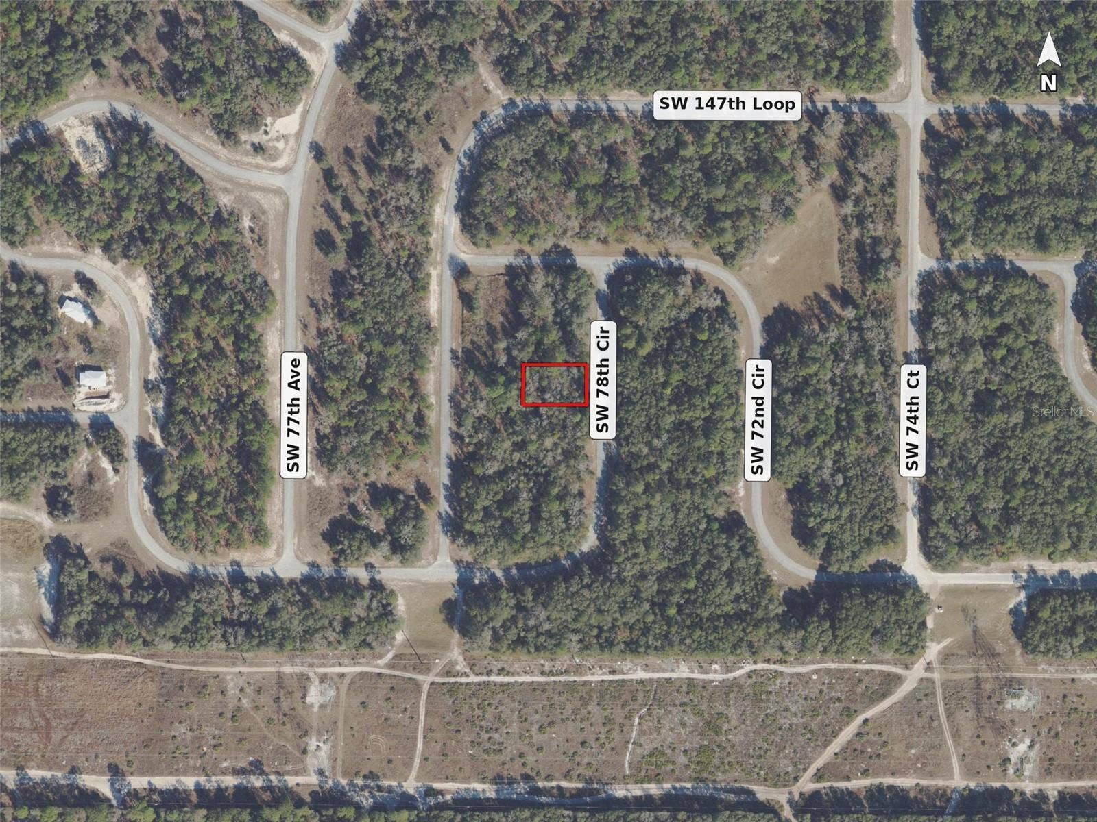 Neighborhood aerial, lot outlined in red