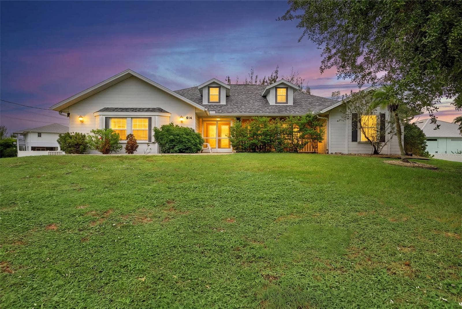 614 RIO VILLA DRIVE, Punta Gorda, FL 33950 Front Exterior at Twilight