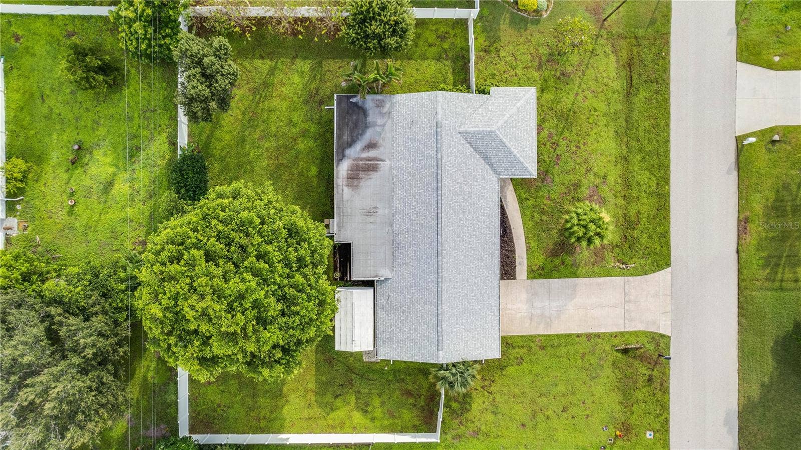 This home is perfectly positioned on a triple lot providing privacy and room for a pool.
