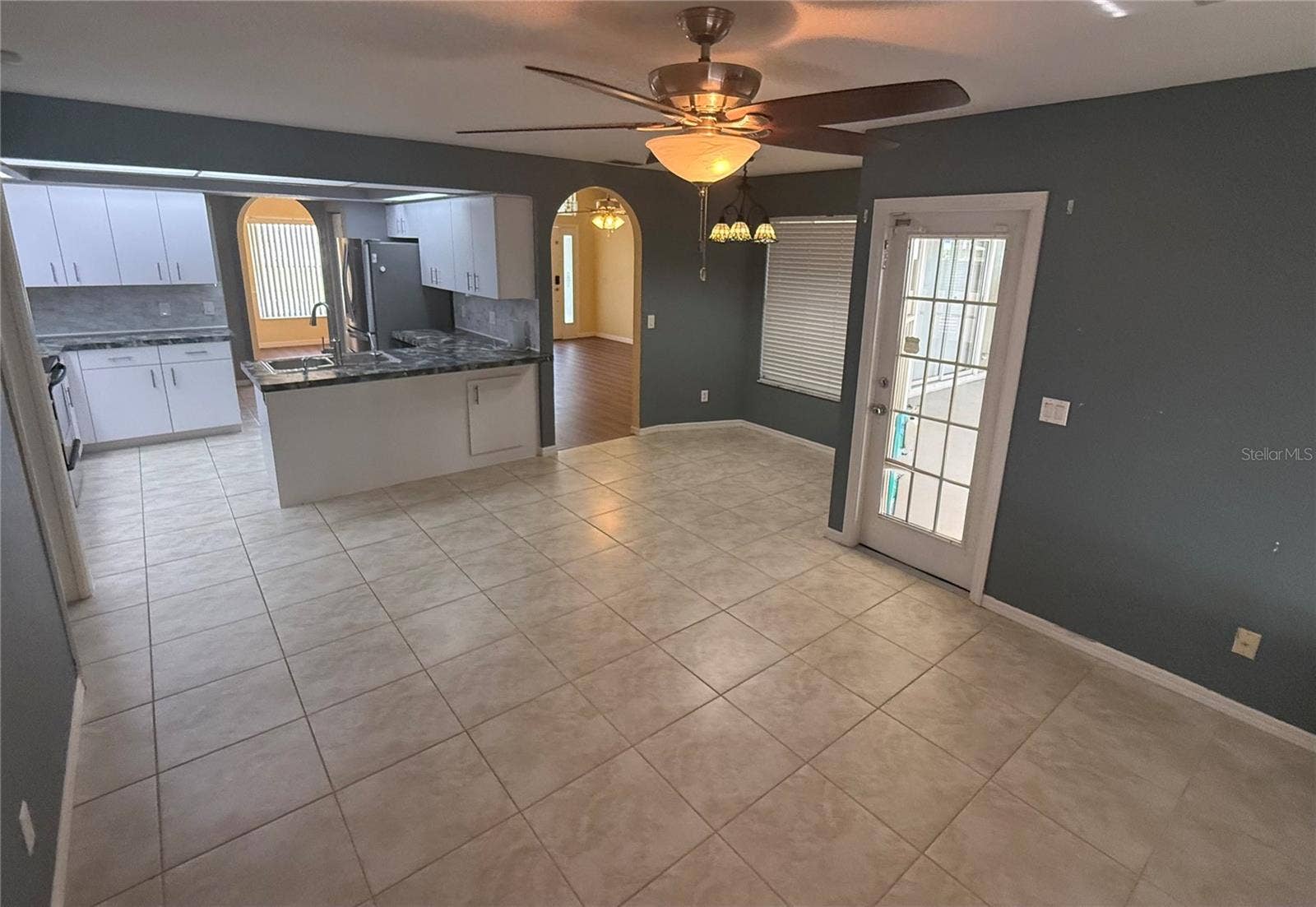 4055 ALLURE LANE, North Port, FL 34287 Family Room, Breakfast Nook and Kitchen. Door to Lanai.