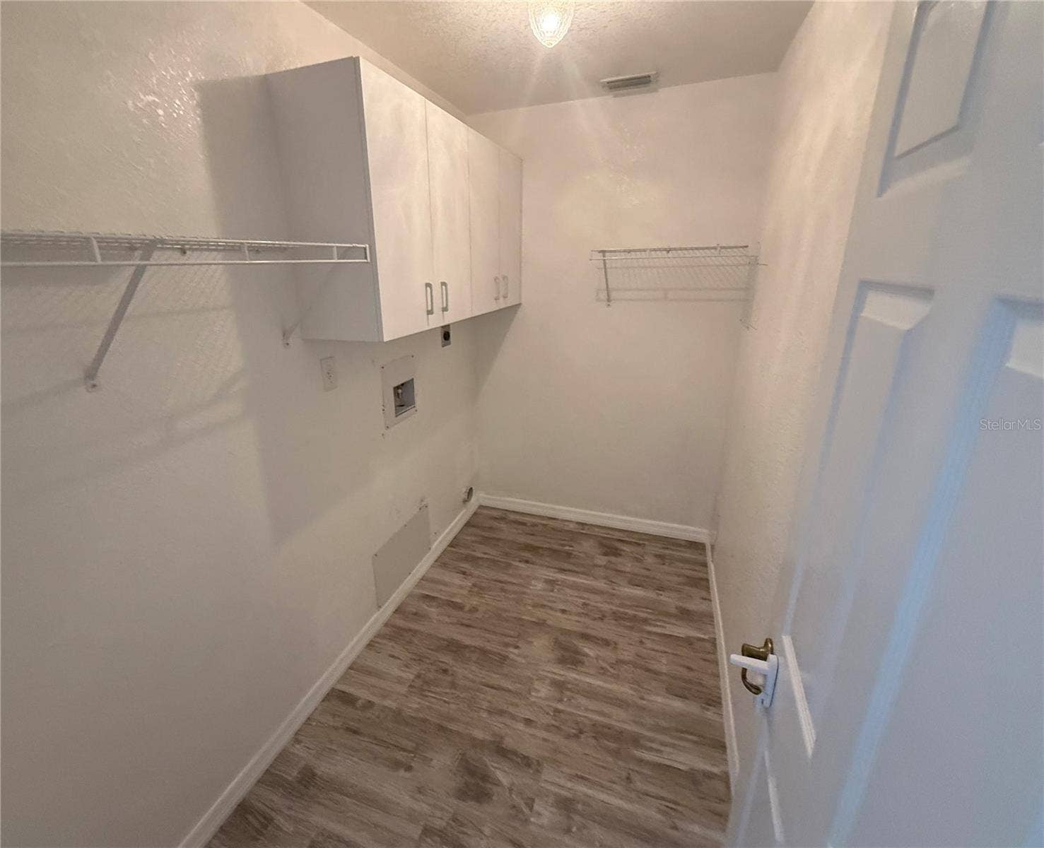 4055 ALLURE LANE, North Port, FL 34287 Inside Laundry Room with cabinetry.