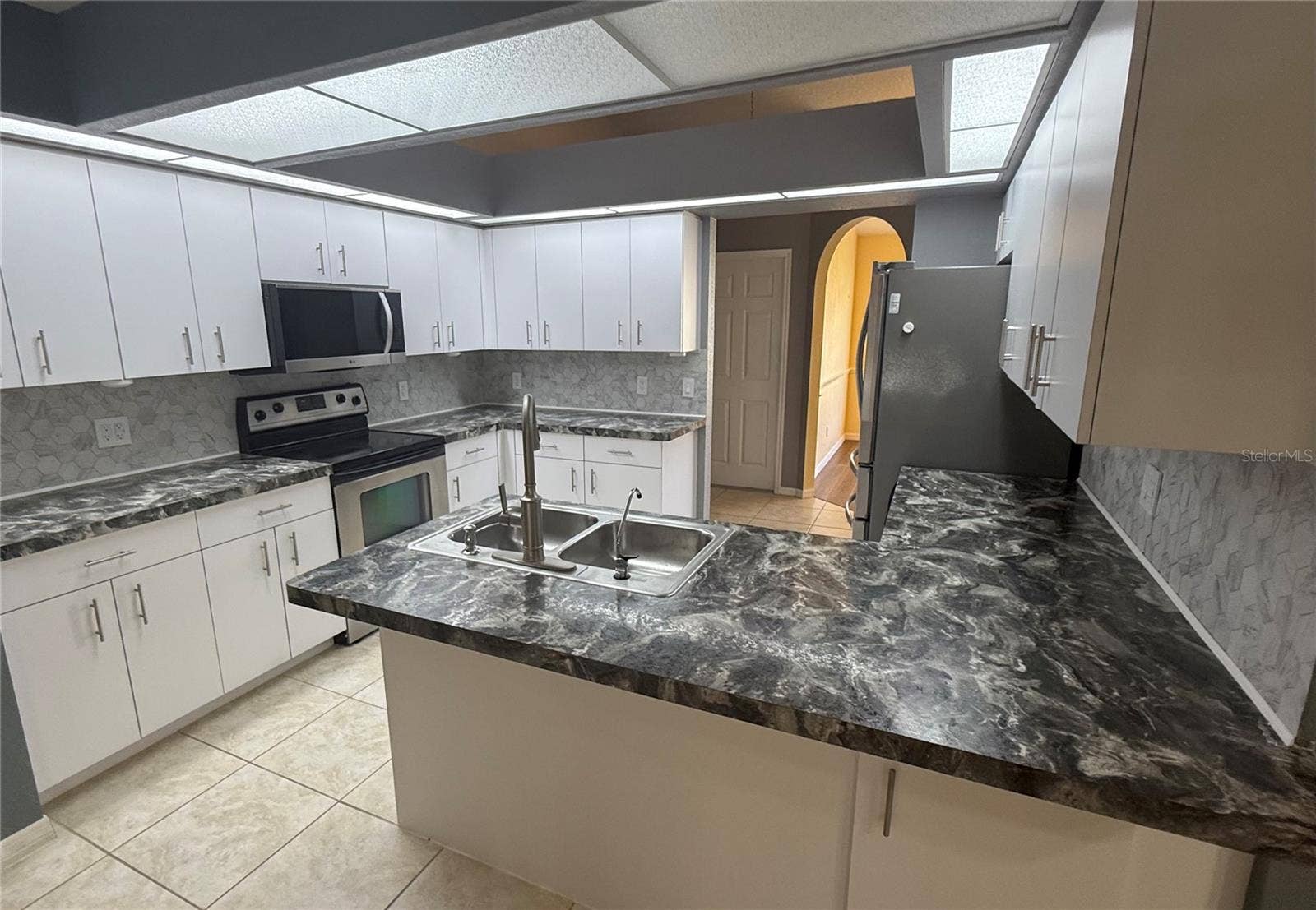 4055 ALLURE LANE, North Port, FL 34287 Kitchen with double sink, eat at counter.