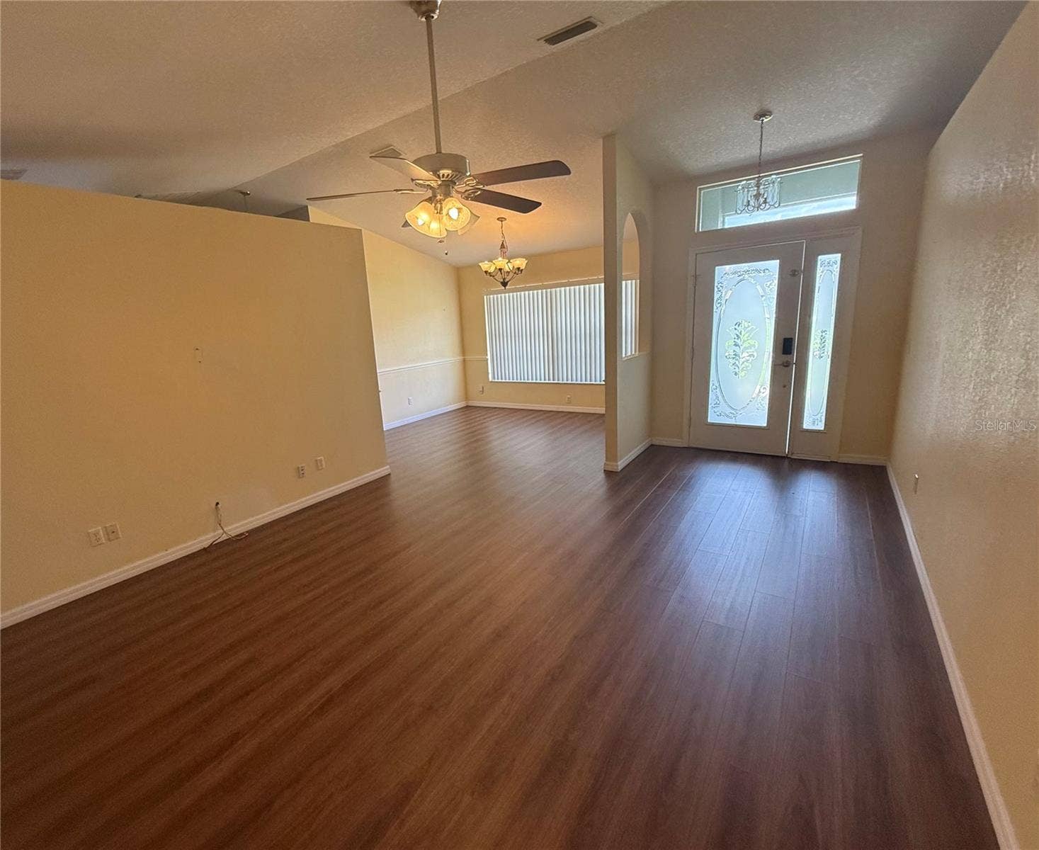 4055 ALLURE LANE, North Port, FL 34287 Living Room with view of the entry and dining room.