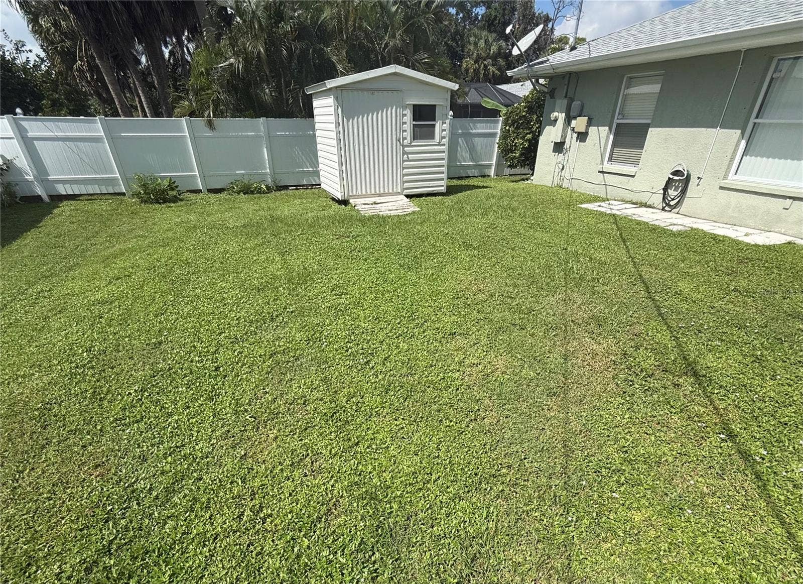 4055 ALLURE LANE, North Port, FL 34287 Private backyard with convenient shed and privacy fence.