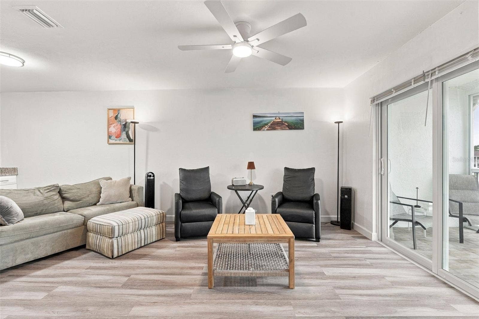 12538 SW KINGSWAY CIRCLE, #1008, Lake Suzy, FL 34269 Spacious Living Room with Direct Access to the Lanai