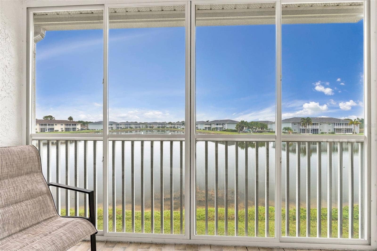 12538 SW KINGSWAY CIRCLE, #1008, Lake Suzy, FL 34269 Peaceful Waterfront Retreat from Your Private Lanai