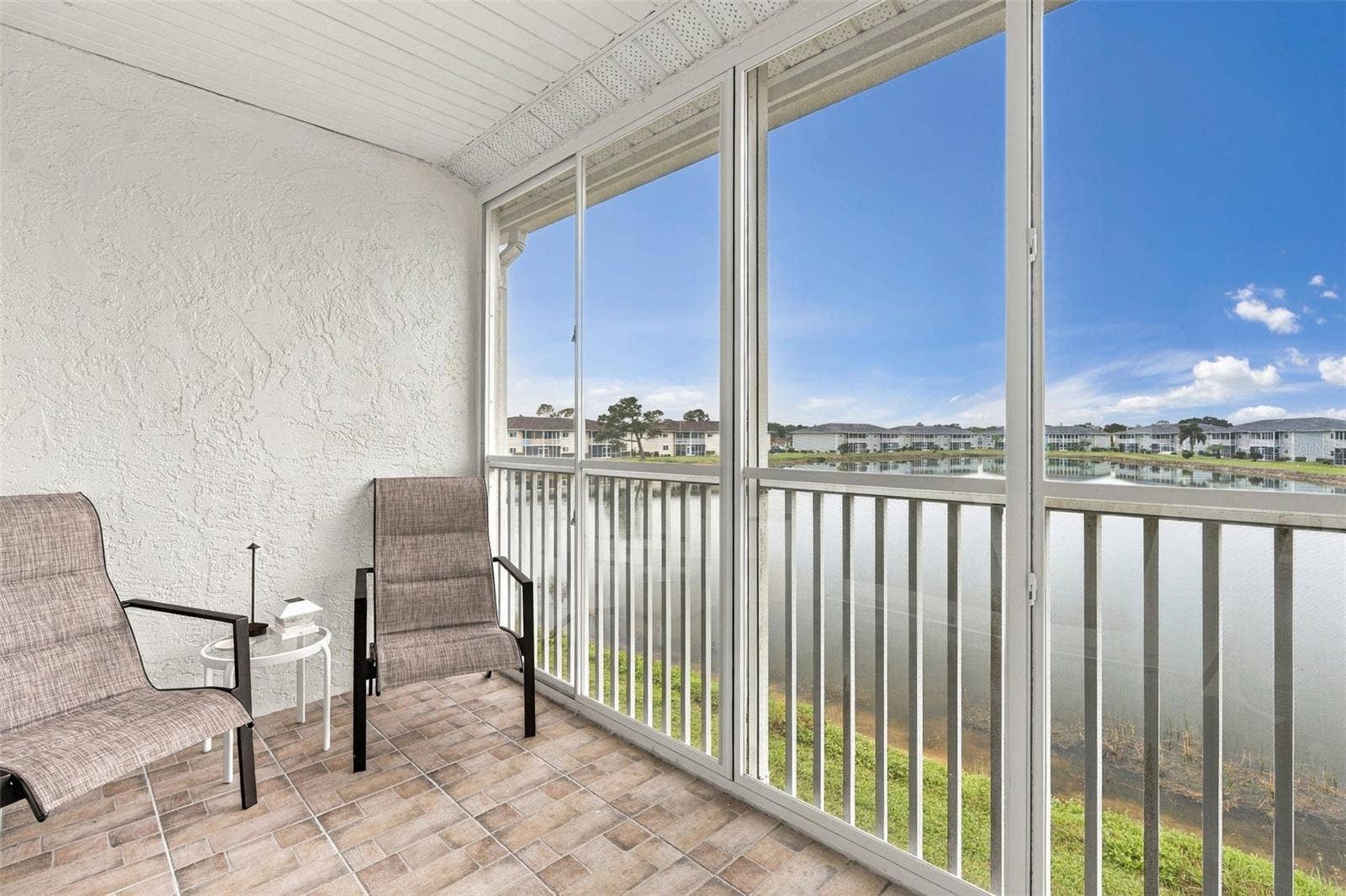 12538 SW KINGSWAY CIRCLE, #1008, Lake Suzy, FL 34269 Breathtaking Panoramic Lake Views from Expansive Screened Lanai