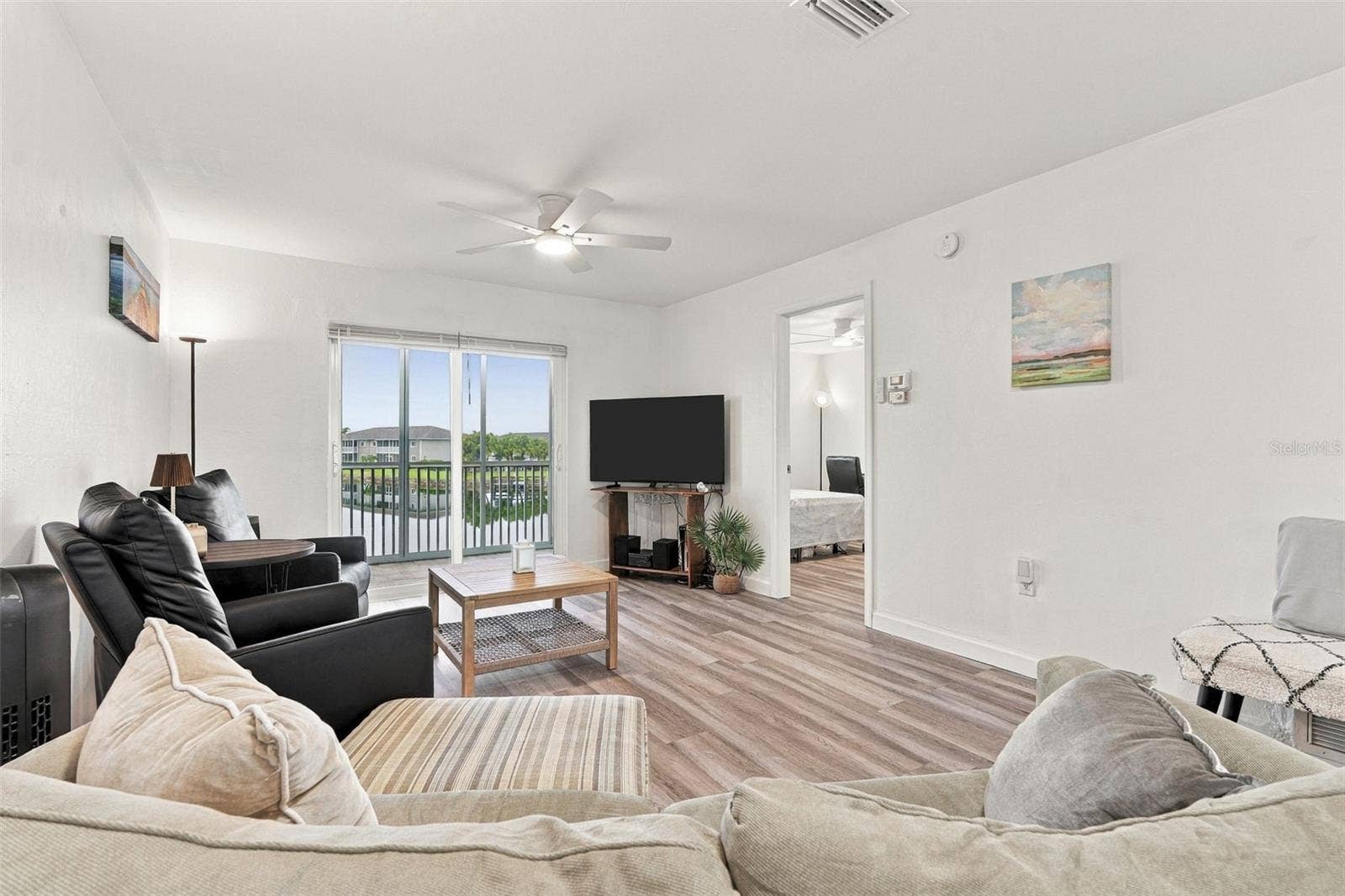12538 SW KINGSWAY CIRCLE, #1008, Lake Suzy, FL 34269 Inviting Living Area with Lanai Access