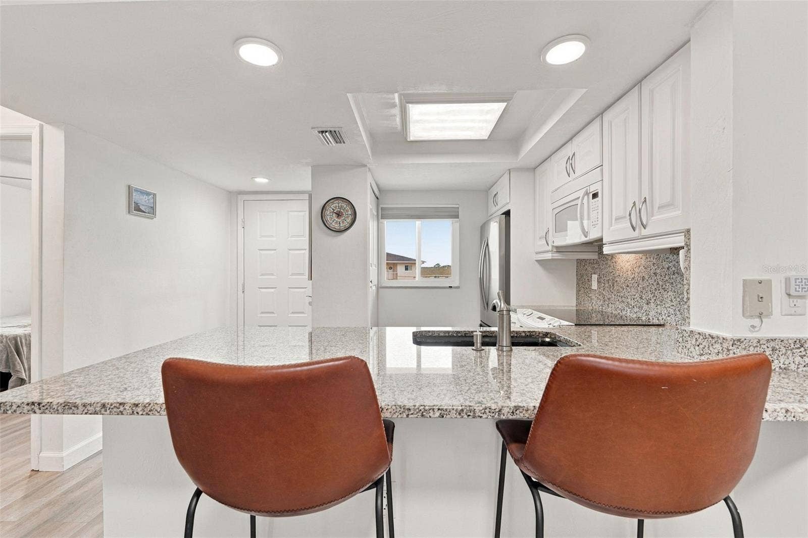 12538 SW KINGSWAY CIRCLE, #1008, Lake Suzy, FL 34269 Breakfast Bar with Pass Through Opening to Kitchen