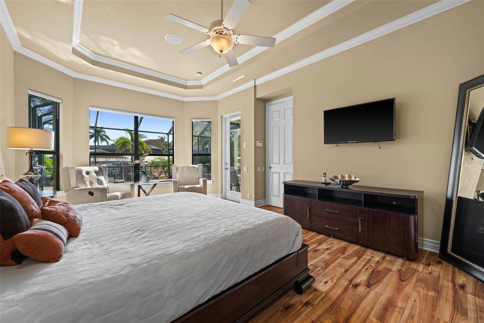 Primary bedroom with amazing views of the pool and water