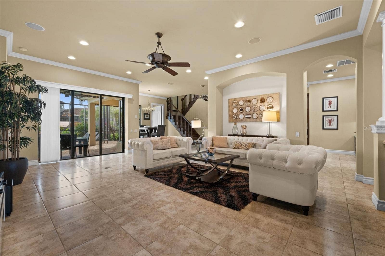 Grand open great room looking toward the pool