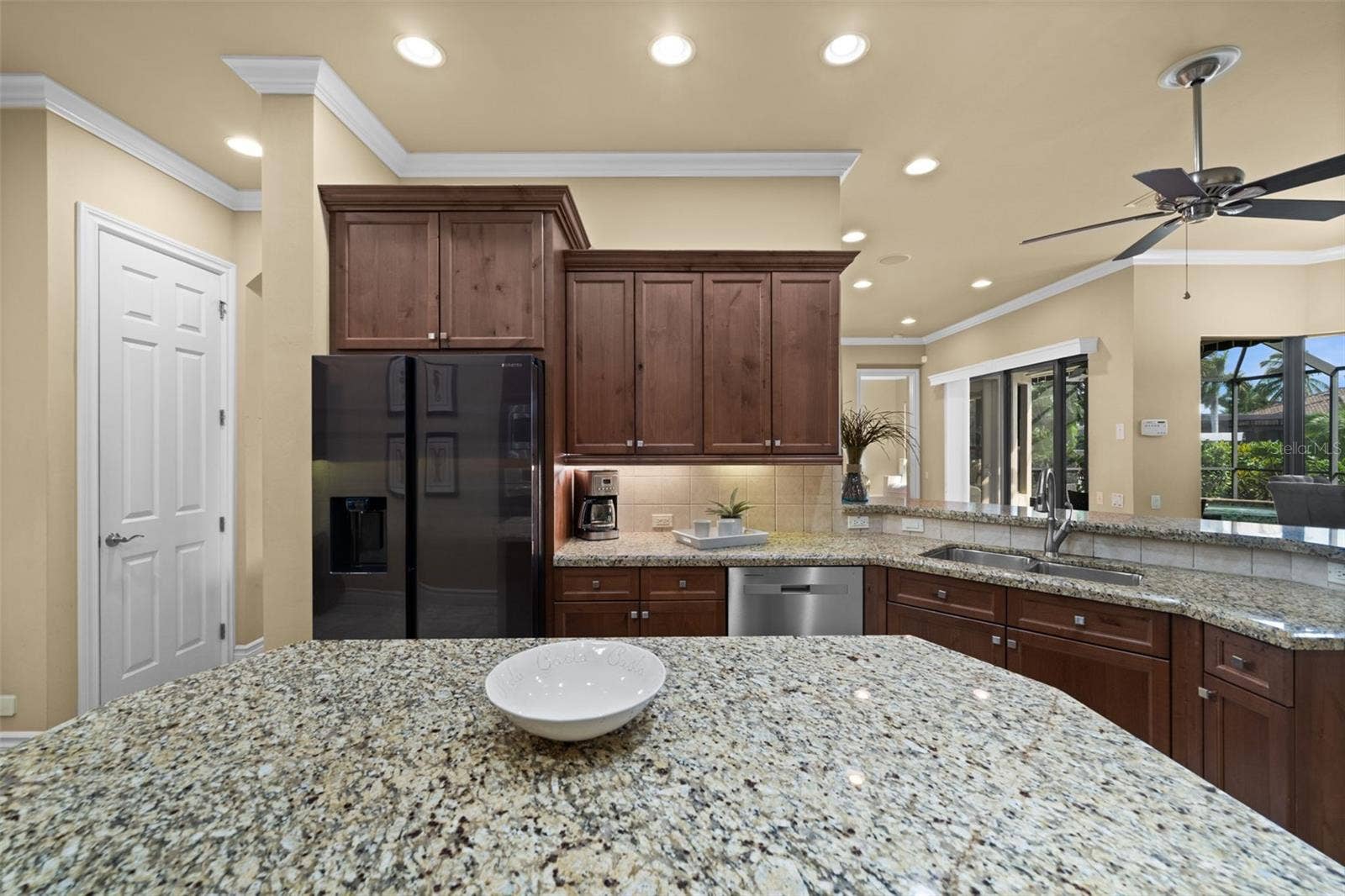 Looking from the kitchen toward the great room and pool area