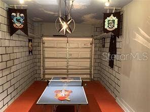 8985 CUBAN PALM RD. ROAD, Kissimmee, FL 34747 game room/Staged