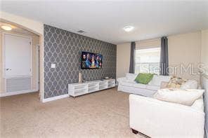 8985 CUBAN PALM RD. ROAD, Kissimmee, FL 34747 2nd level living room/Staged