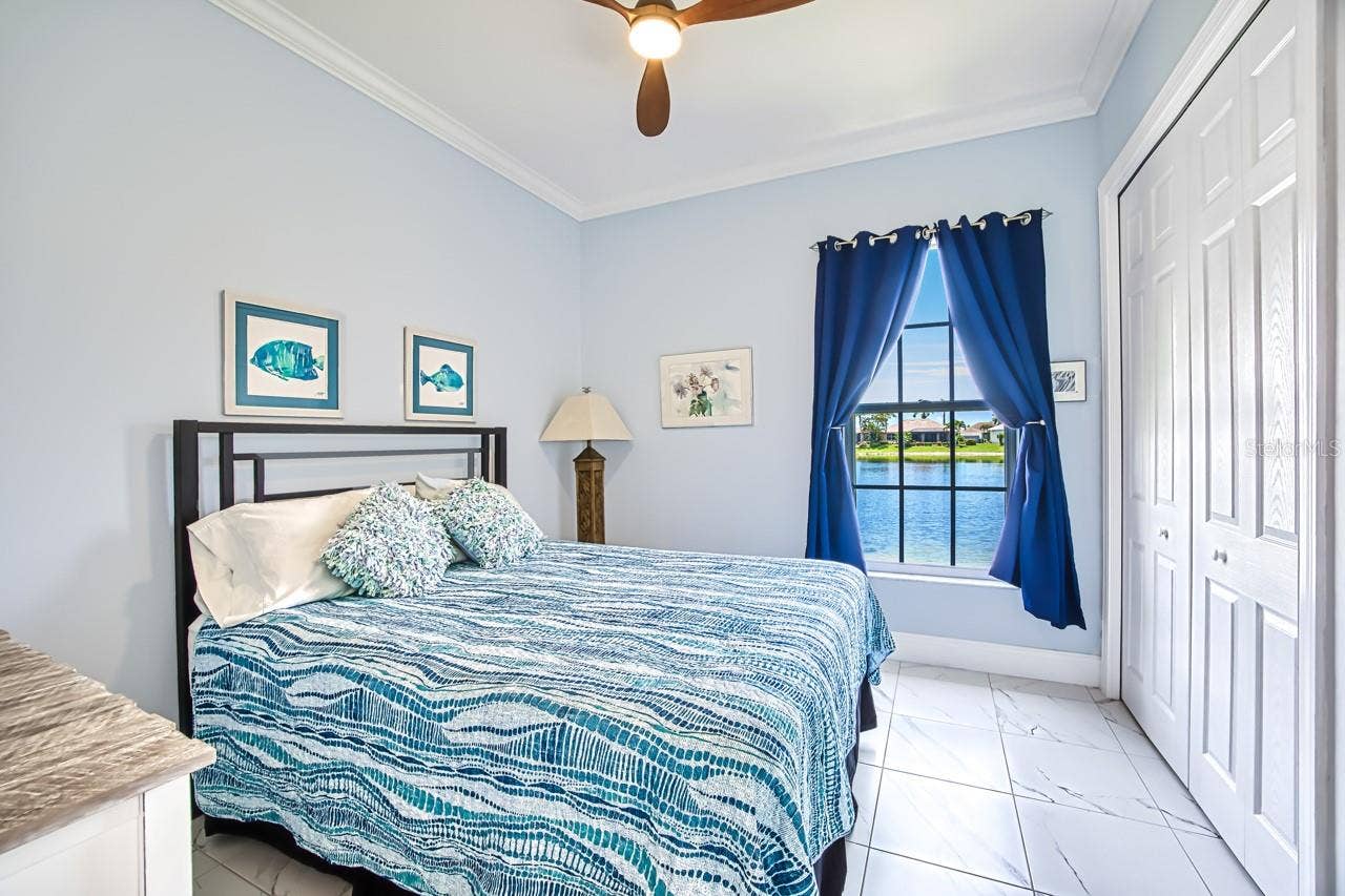 8625 SOUTHWIND BAY CIRCLE, Fort Myers, FL 33908 Guest Bedroom overlooking the lake