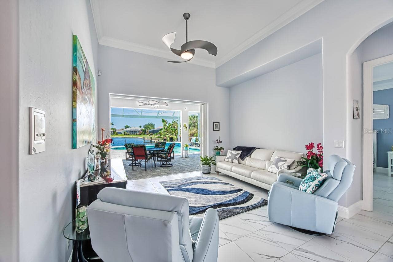 8625 SOUTHWIND BAY CIRCLE, Fort Myers, FL 33908 Living room to lanai