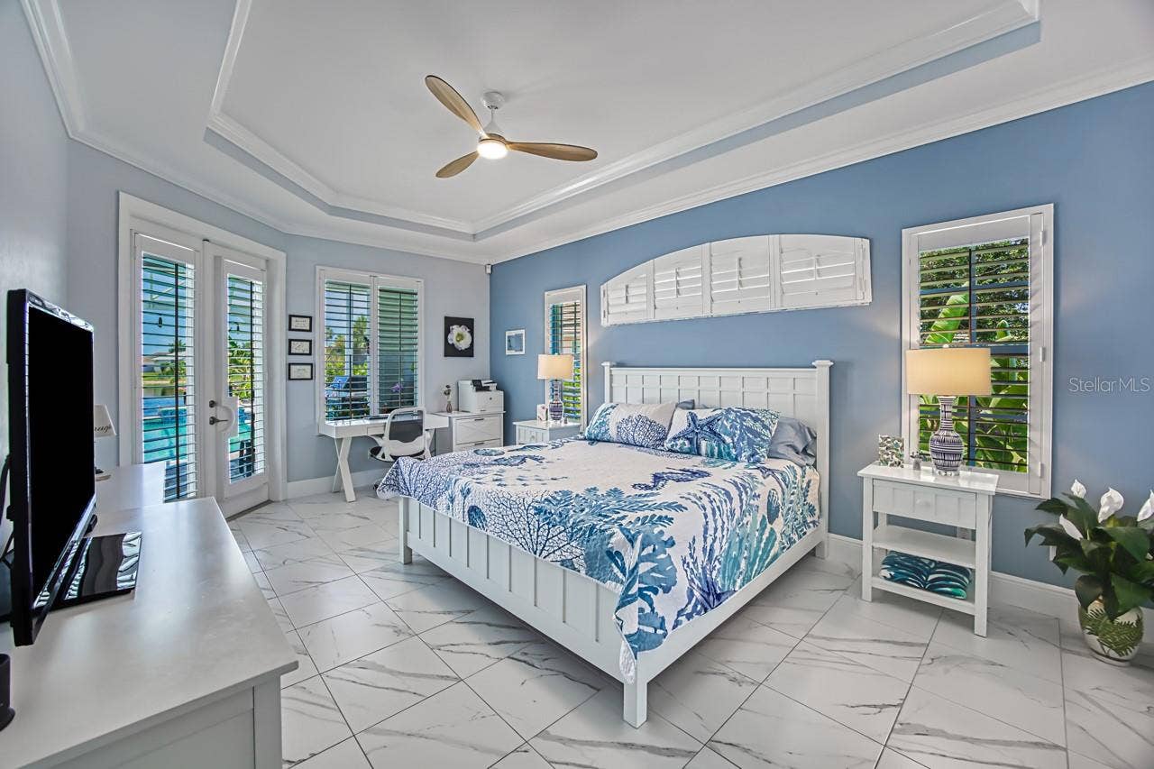 8625 SOUTHWIND BAY CIRCLE, Fort Myers, FL 33908 Primary Suite with French doors out to lanai/pool area