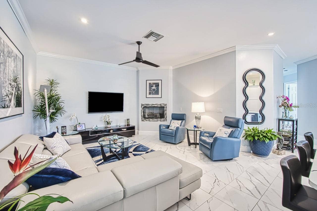 8625 SOUTHWIND BAY CIRCLE, Fort Myers, FL 33908 Family room with gas fireplace and recessed lighting