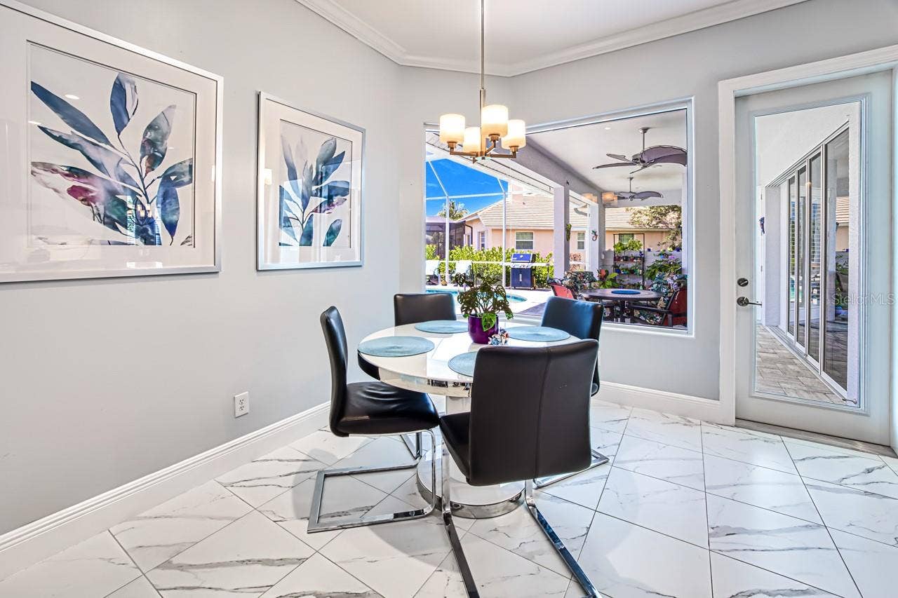 8625 SOUTHWIND BAY CIRCLE, Fort Myers, FL 33908 Dinette with pool view