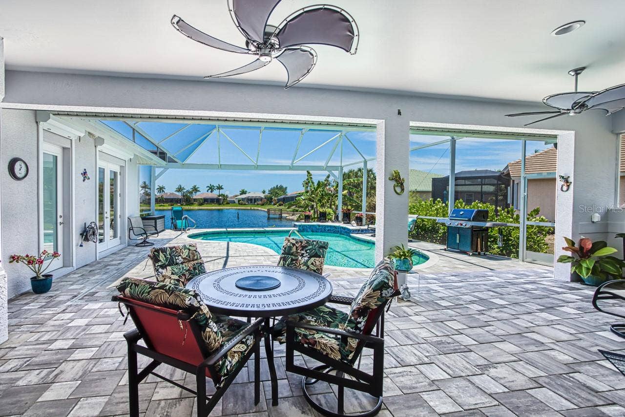 8625 SOUTHWIND BAY CIRCLE, Fort Myers, FL 33908 Lanai overlooking pool and lake