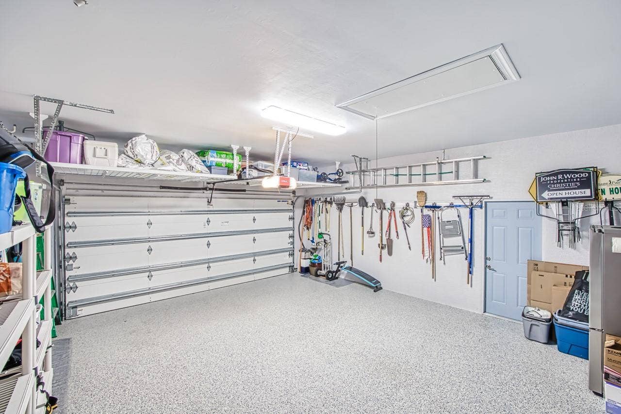 8625 SOUTHWIND BAY CIRCLE, Fort Myers, FL 33908 Overhead storage over garage door.