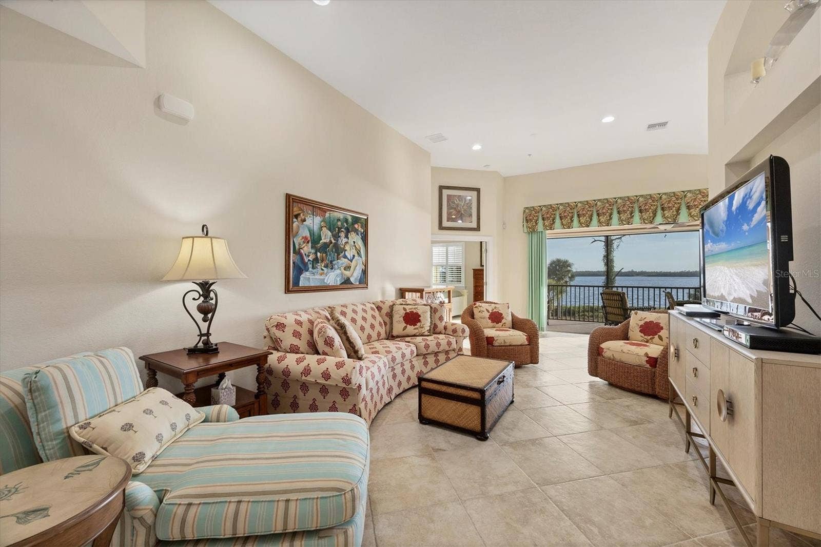 Living Room - View of screened porch/vaulted ceilings