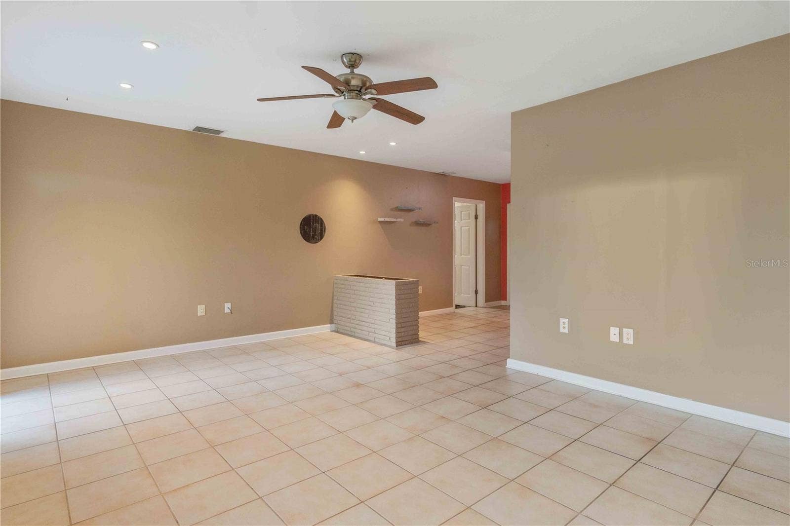 11144 3RD AVENUE, Punta Gorda, FL 33955 Living room facing kitchen