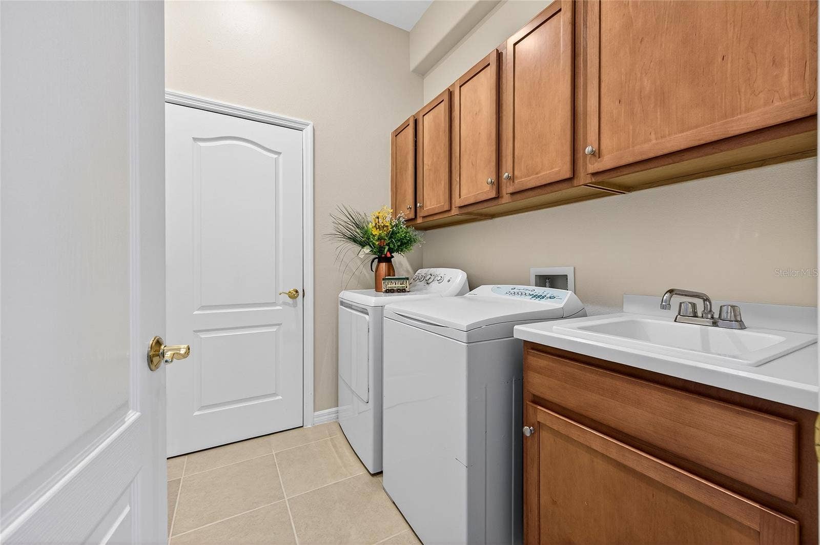 1832 KNIGHTS BRIDGE TRAIL, Port Charlotte, FL 33980 Laundry room with utility tub and closet