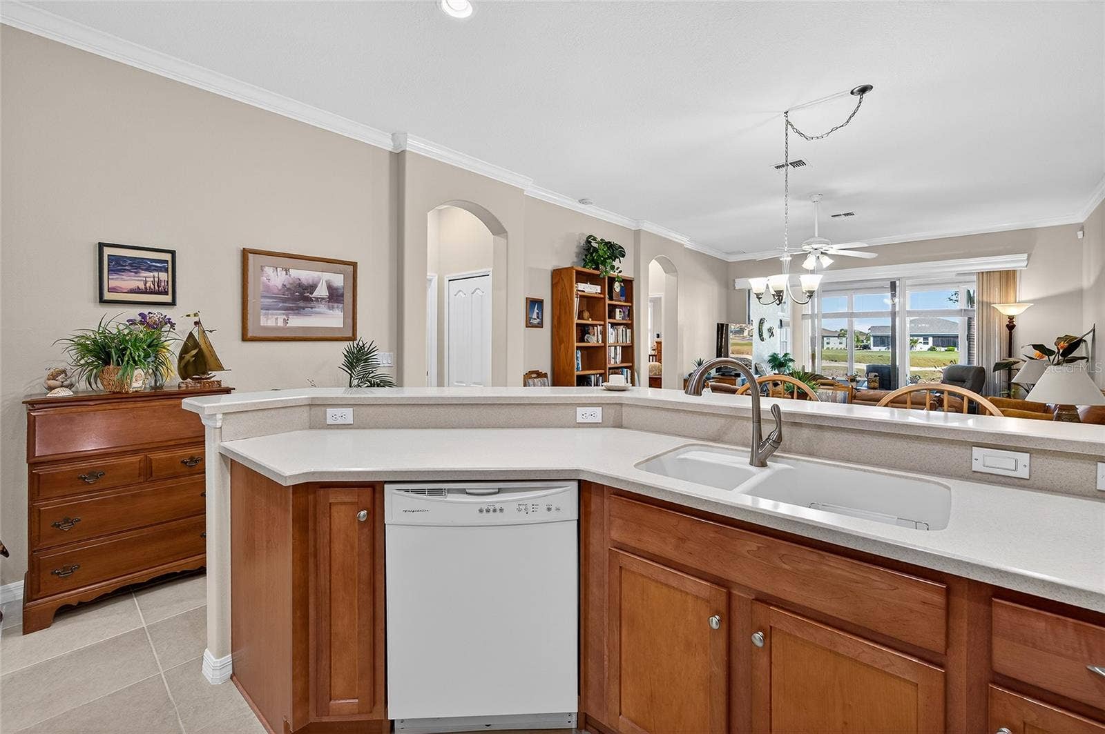 1832 KNIGHTS BRIDGE TRAIL, Port Charlotte, FL 33980 Kitchen island looking out to the beautiful lake and lanai.