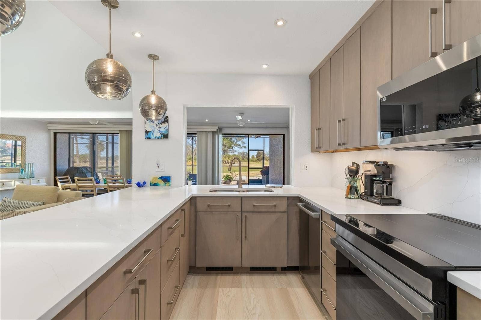 5021 SAN ROCCO COURT, Punta Gorda, FL 33950 Open to dining/family room with views of golf course.