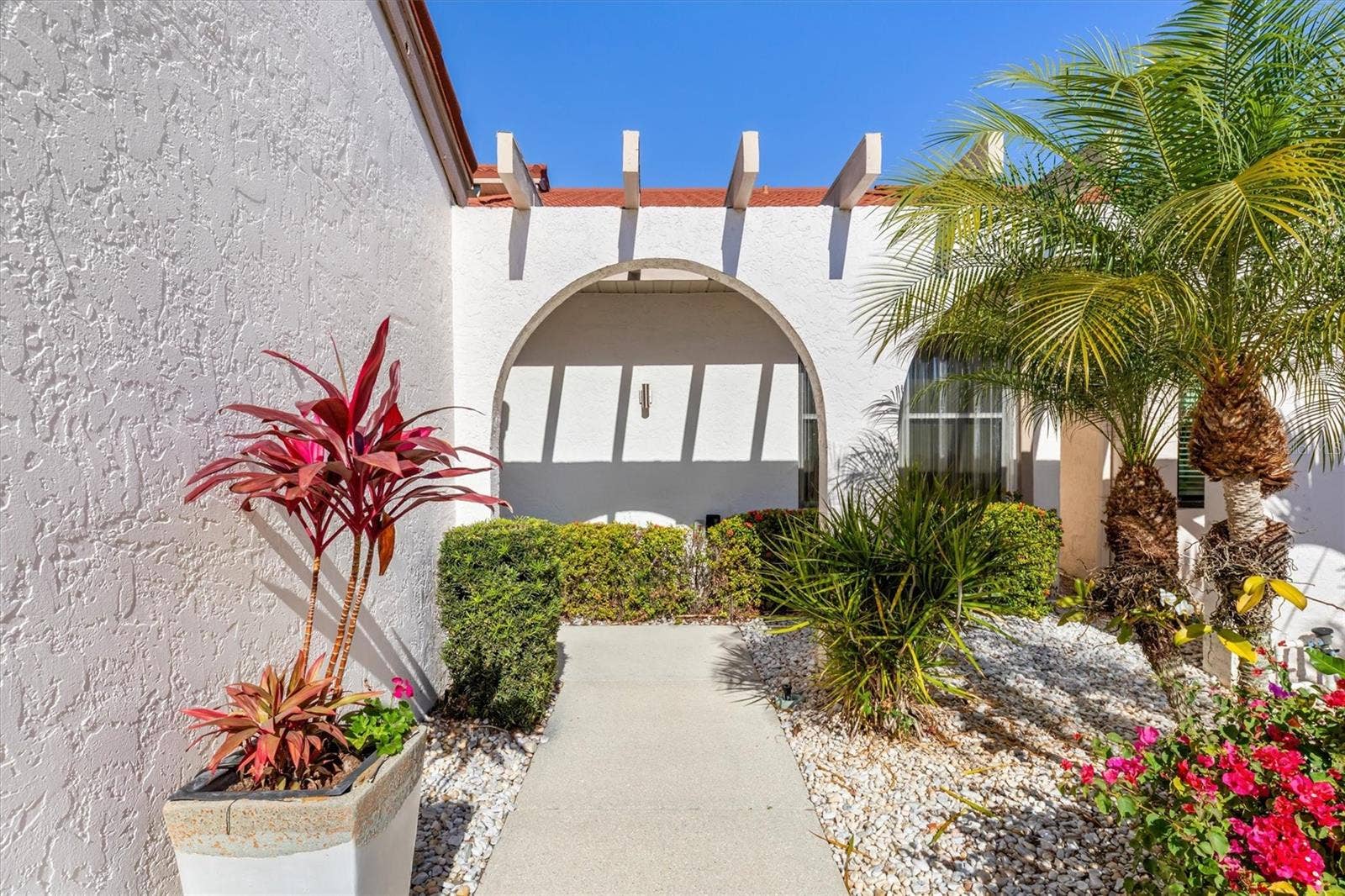 5021 SAN ROCCO COURT, Punta Gorda, FL 33950 Charming arched sidewalk