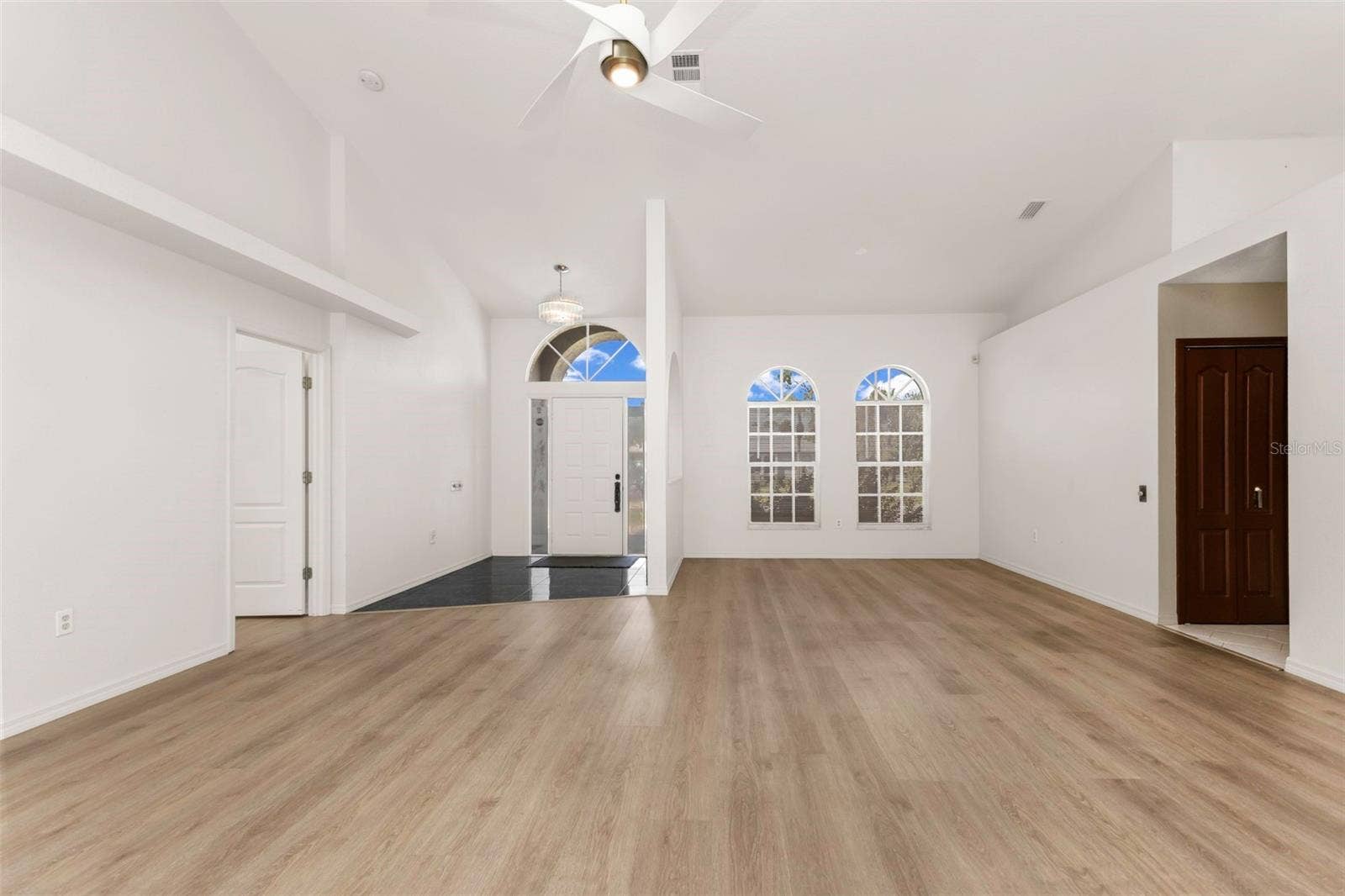 5184 ELLSWORTH TERRACE, Port Charlotte, FL 33981 Living room looking at front door/foyer