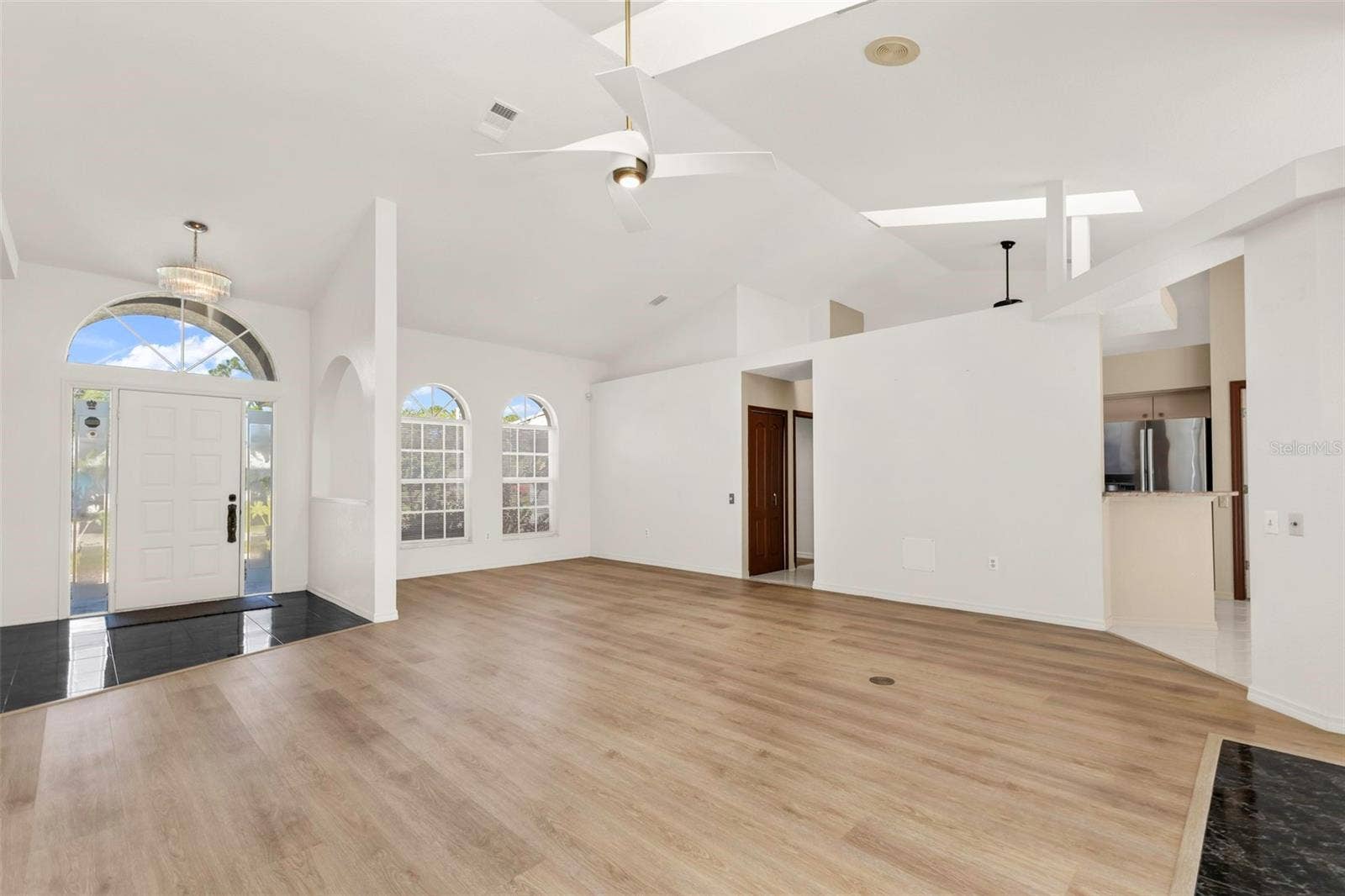 5184 ELLSWORTH TERRACE, Port Charlotte, FL 33981 Living room looking at foyer and formal dinning or flex space