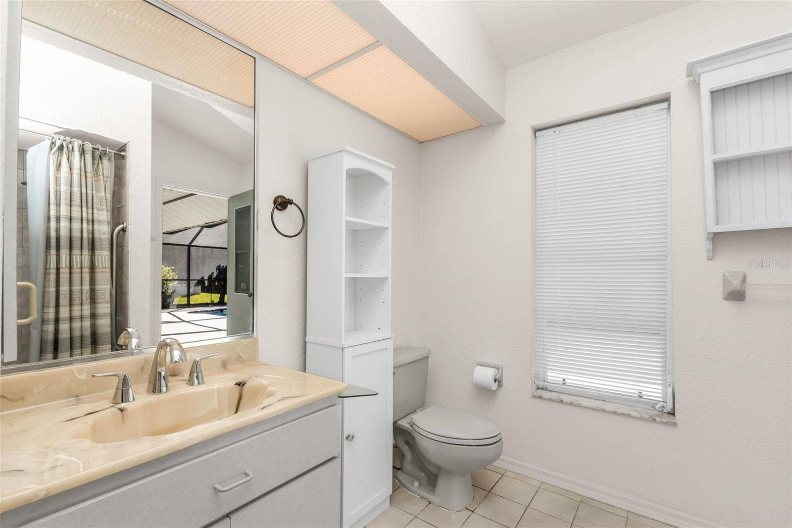 5184 ELLSWORTH TERRACE, Port Charlotte, FL 33981 Guest bath w/access to the pool